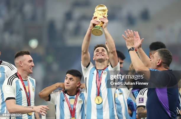 Julian Alvarez of Argentina celebrates with The FIFA World Cup Qatar 2022 Winner's Trophy after winning the FIFA World Cup Qatar 2022 Final match...