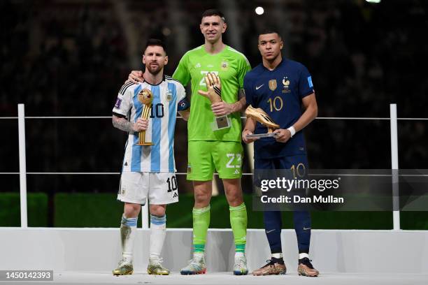 Adidas Golden Ball winner Lionel Messi, adidas Golden Glove winner Emiliano Martinez of Argentina and adidas Golden Boot winner Kylian Mbappe of...