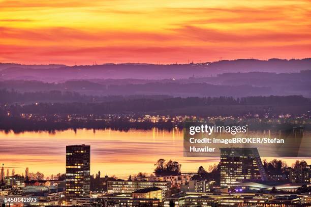 evening mood with skyline and lake zug in the foreground the skyscrapers parktower and uptown, zug, canton zug, switzerland - zug stock pictures, royalty-free photos & images