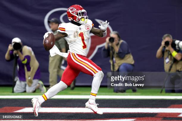 Jerick McKinnon of the Kansas City Chiefs rushes for a touchdown during overtime against the Houston Texans at NRG Stadium on December 18, 2022 in...