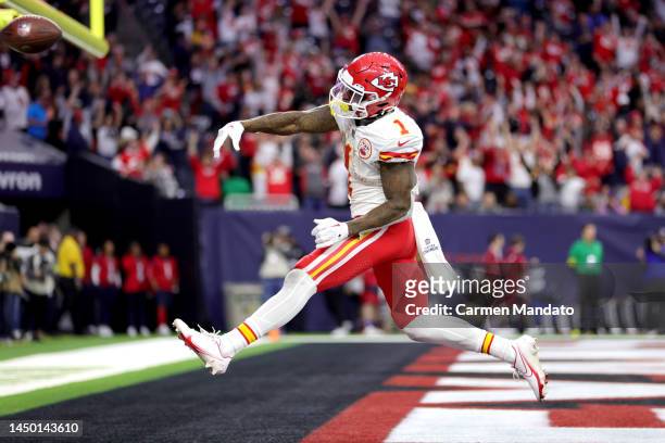 Jerick McKinnon of the Kansas City Chiefs celebrates a touchdown during overtime against the Houston Texans at NRG Stadium on December 18, 2022 in...