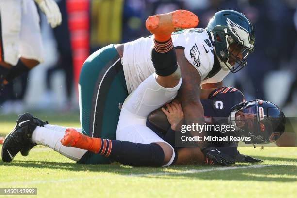 Javon Hargrave of the Philadelphia Eagles sacks Justin Fields of the Chicago Bears during the third quarter at Soldier Field on December 18, 2022 in...