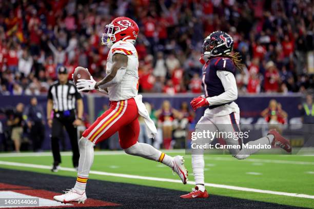 Jerick McKinnon of the Kansas City Chiefs rushes for a touchdown during overtime against the Houston Texans at NRG Stadium on December 18, 2022 in...