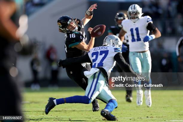 Trevor Lawrence of the Jacksonville Jaguars fumbles the ball during the fourth quarter of the game against the Dallas Cowboys at TIAA Bank Field on...