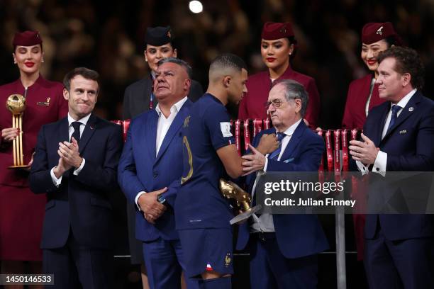 Noel Le Graet, President of the French Football Federation, congratulates Kylian Mbappe of France during the awards ceremony after the FIFA World Cup...