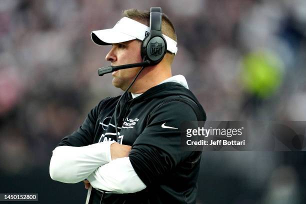 Head coach Josh McDaniels of the Las Vegas Raiders look on against the New England Patriots during the first half of the game at Allegiant Stadium on...