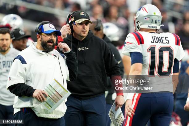 Coach Matt Patricia and Mac Jones of the New England Patriots react during the first half against the Las Vegas Raiders at Allegiant Stadium on...