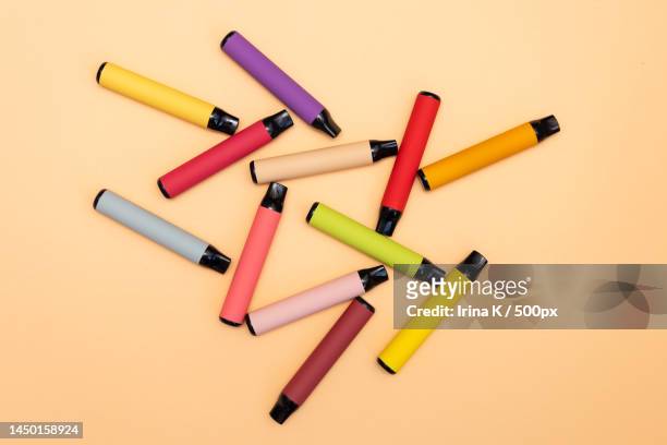 disposable e-cigarettes,different flavors in orange the concept of - e zigarette stock-fotos und bilder