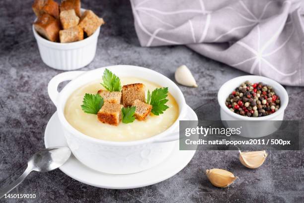 cauliflower potato soup puree on stone background,creamy cauliflower soup,stavropol,stavropol krai,russia - creamy cauliflower and potato soup stock pictures, royalty-free photos & images