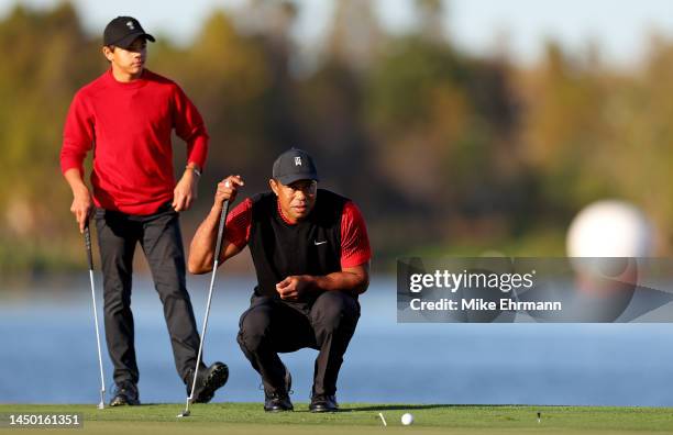 Tiger Woods and Charlie Woods line up a putt during the final round of the PNC Championship at Ritz-Carlton Golf Club on December 18, 2022 in...