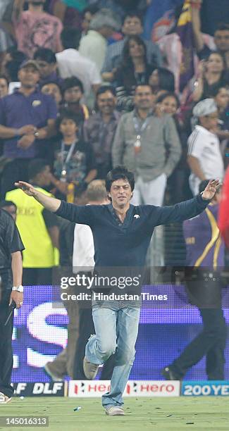 Kolkata Knight Riders co-owner Shah Rukh Khan celebrate his teams victory against Delhi Daredevils during the first qualifier of IPL 5 on May 22,...