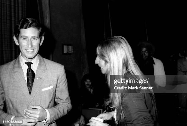 Prince Charles and singer Barbra Streisand share a moment over coffee at Warner Bros. Studio on March 19, 1974 in Los Angeles, California.