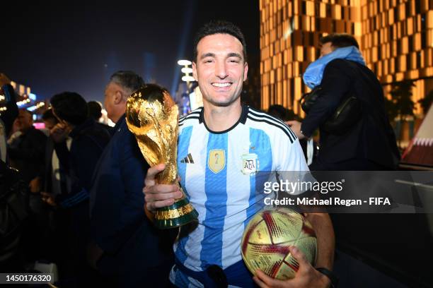 Lionel Scaloni, Head Coach of Argentina, celebrates after winning the FIFA World Cup on an open top bus outside the stadium during the FIFA World Cup...