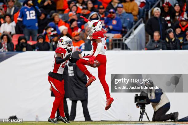 Budda Baker of the Arizona Cardinals celebrates with Nate Hairston of the Arizona Cardinals after an interception during the third quarter in the...