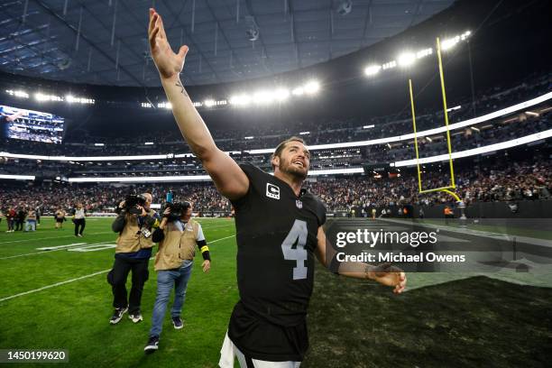 Derek Carr of the Las Vegas Raiders celebrates after defeating the New England Patriots following an NFL football game between the Las Vegas Raiders...