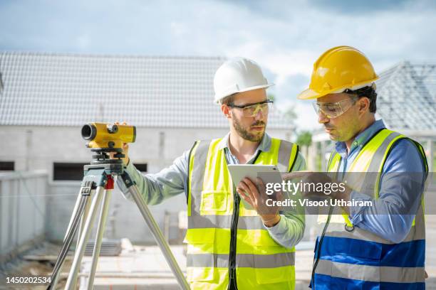 engineer use theodolite and total station at construction site. - land surveyor stock pictures, royalty-free photos & images