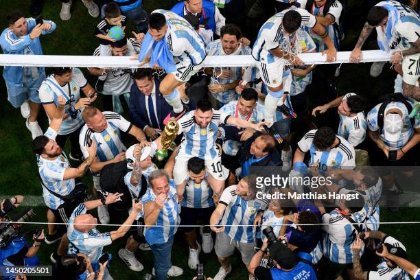 Lionel Messi of Argentina lifts the FIFA World Cup Qatar 2022 Winner's Trophy after the team's victory during the FIFA World Cup Qatar 2022 Final...