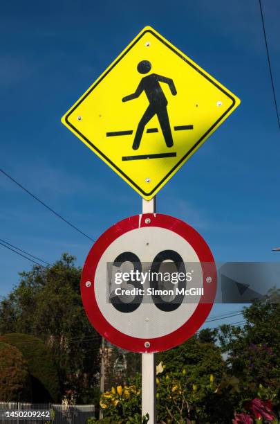 pedestrian crossing traffic warning sign and 30 kilometer per hour speed limit sign - pedestrian crossing sign stock pictures, royalty-free photos & images