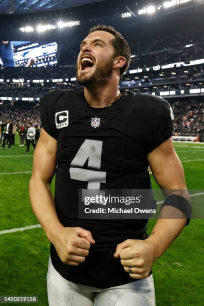 Derek Carr of the Las Vegas Raiders celebrates after defeating the New England Patriots following an NFL football game between the Las Vegas Raiders...