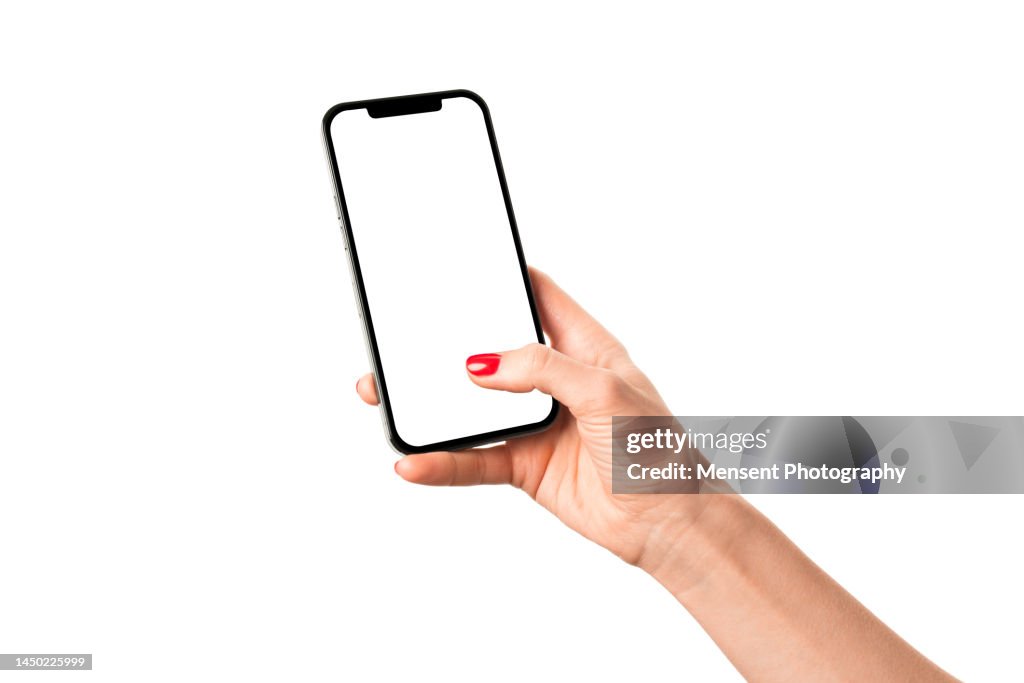 Womans hand holding modern mobile phone iphone mockup with white screen on white background