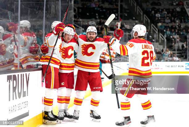Tyler Toffoli of the Calgary Flames celebrates with teammates after he scored a goal against the San Jose Sharks during the first period at SAP...