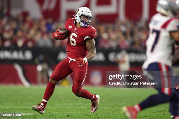 Running back James Conner of the Arizona Cardinals rushes the football during the NFL game at State Farm Stadium on December 12, 2022 in Glendale,...