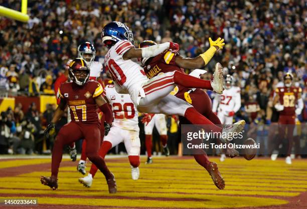Darnay Holmes of the New York Giants breaks up a pass intended for Curtis Samuel of the Washington Commanders during the fourth quarter at FedExField...