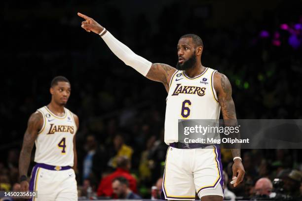 LeBron James of the Los Angeles Lakers signals to teammates in the second half against the Washington Wizards at Crypto.com Arena on December 18,...