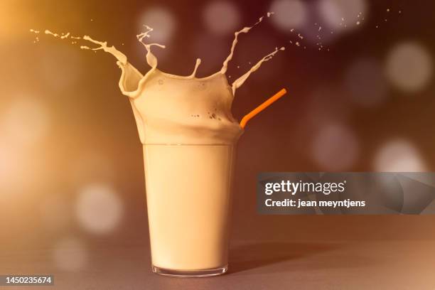 splashing glass of delicious and sweet horchata of chufa - hafermilch stock-fotos und bilder