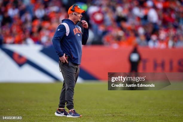 Head coach Nathaniel Hackett of the Denver Broncos stands on the field against the Kansas City Chiefs in the first half at Empower Field at Mile High...