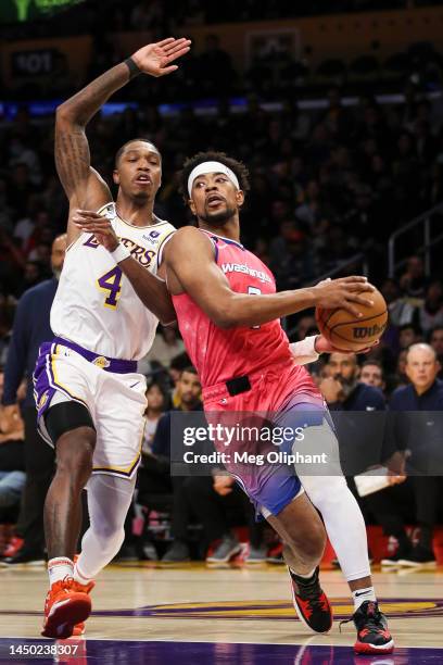 Jordan Goodwin of the Washington Wizards handles the ball defended by Lonnie Walker IV of the Los Angeles Lakers in the second half at Crypto.com...