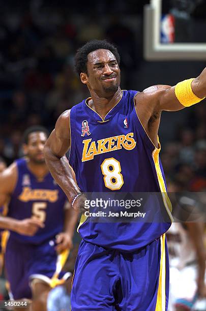Kobe Bryant of the Los Angeles Lakers grimaces in pain after taking a hard shot during a game against the Memphis Grizzlies at The Pyramid in...