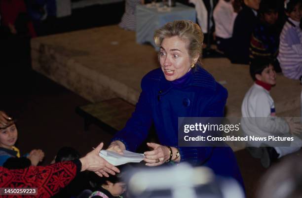 American First Lady of the United States Hillary Clinton, wearing a blue coat during a visit to the Fenwick Center in Arlington, Virginia, 12th...