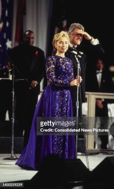 American First Lady of the United States Hillary Clinton and her husband, American politician Bill Clinton, President of the United States, onstage...