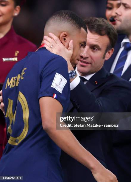 Kylian Mbappe of France with Emmanuel Macron president of france after the FIFA World Cup Qatar 2022 Final match between Argentina and France at...