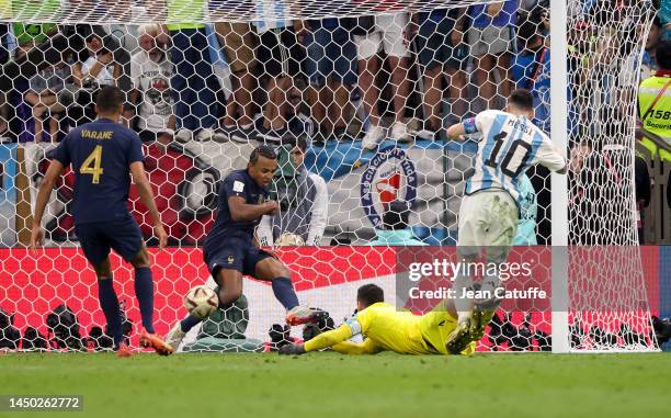 Lionel Messi of Argentina scores his second goal, beating France goalkeeper Hugo Lloris and Jules Kounde during the FIFA World Cup Qatar 2022 Final...