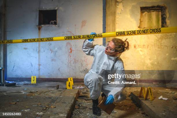 female forensics police office on duty - criminal investigation stock pictures, royalty-free photos & images