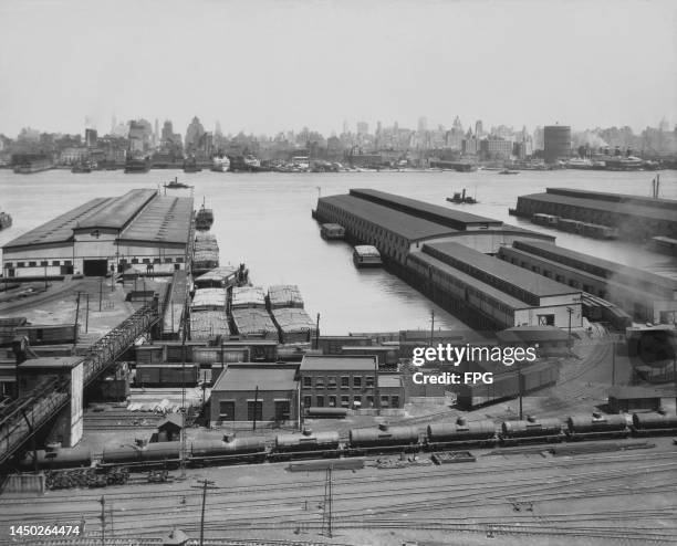 High-angle view of rail lines at Weehawken Railroad Terminal, a waterfront terminal on the North River in Weehawken, New Jersey, circa 1935. The...