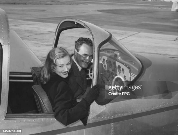 American actress Veronica Lake and her husband, Hungarian-American film director Andre de Toth , in the North American Navion four-seat aircraft...