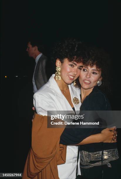 American actress Fernanda Gordon, wearing a white jacket with her mother, Puerto Rican actress, singer and dancer Rita Moreno, wearing a black...