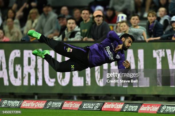 Shadab Khan of the Hurricanes attempts a catch during the Men's Big Bash League match between the Hobart Hurricanes and the Perth Scorchers at...