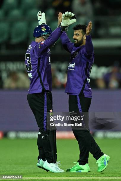 Matthew Wade and Shadab Khan of the Hurricanes celebrate the win during the Men's Big Bash League match between the Hobart Hurricanes and the Perth...