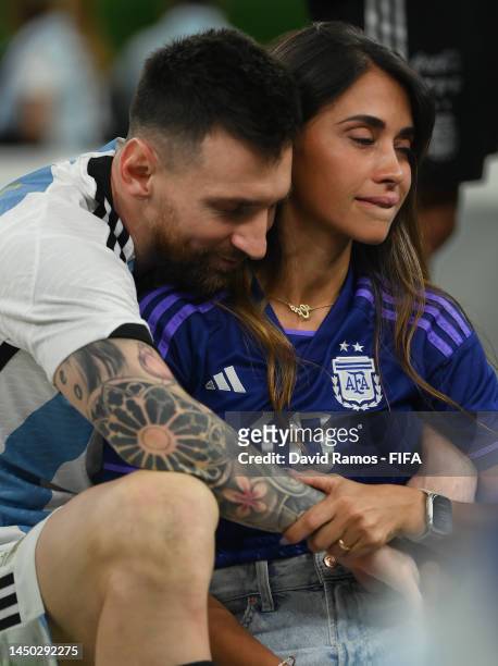 Lionel Messi of Argentina celebrates with his wife Antonela Roccuzzo and the FIFA World Cup Qatar 2022 Winner's Trophy following the FIFA World Cup...