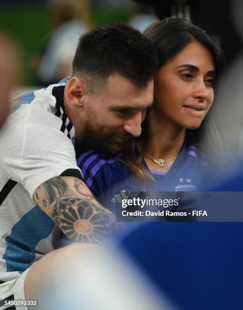 Lionel Messi of Argentina celebrates with his wife Antonela Roccuzzo and the FIFA World Cup Qatar 2022 Winner's Trophy following the FIFA World Cup...