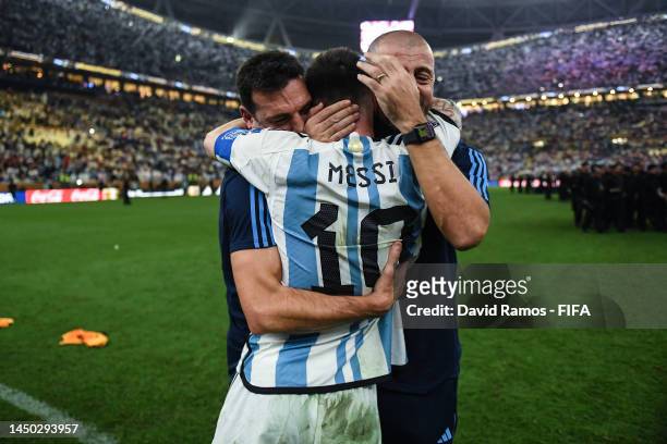 Headcoach Lionel Scaloni of Argentina celebrates with Lionel Messi of Argentina after the victory in the penalty shoot out during the FIFA World Cup...