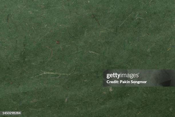 mulberry paper texture background in close-up. - green parchment stock pictures, royalty-free photos & images