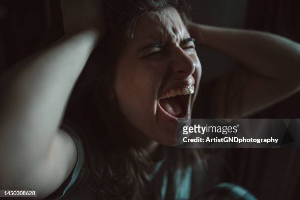 woman screaming for having a mental breakdown. - psychopathy stock pictures, royalty-free photos & images