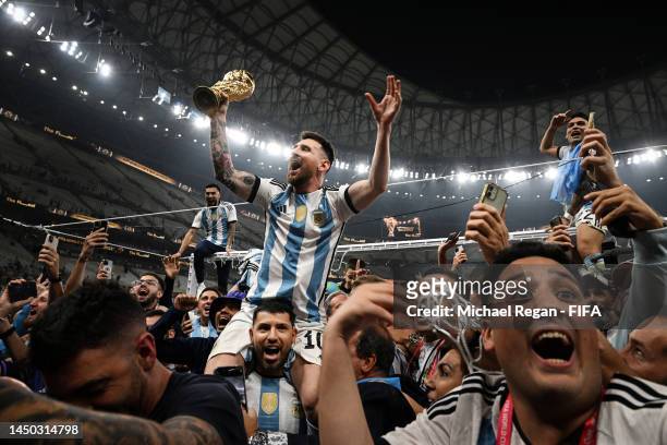 Lionel Messi celebrates with fans and team mates after winning the FIFA World Cup Qatar 2022 Final match between Argentina and France at Lusail...