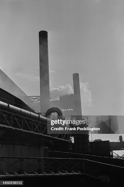 Industrial buildings and smokestacks on the Grand Union Canal, England. Original Publication: Picture Post - 7798 - The Scandal of our Waterways -...