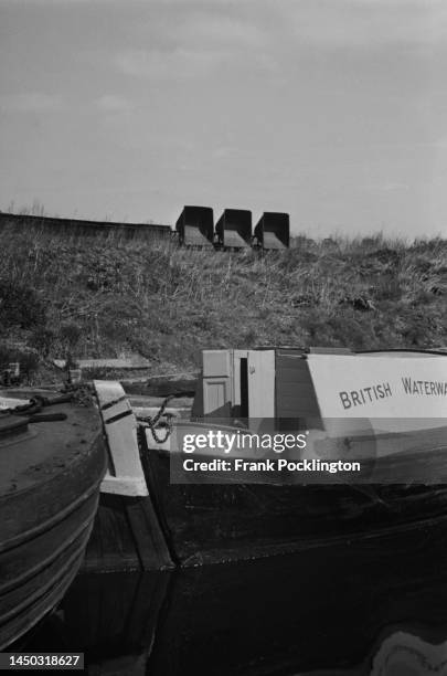 Barge named 'Mars' is moored next to the towpath on the Grand Union Canal, England. Original Publication: Picture Post - 7798 - The Scandal of our...